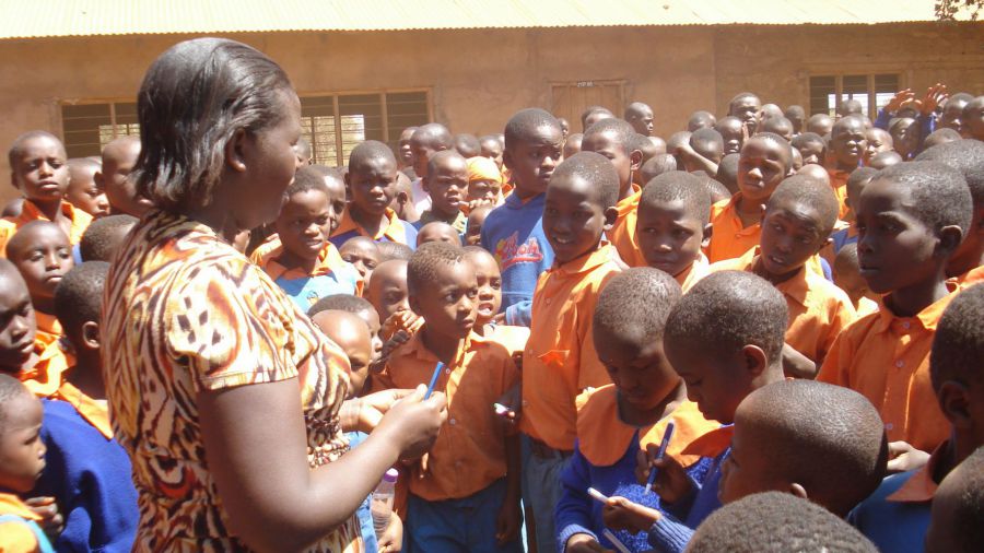 Picture desciription: Photo taken by Pens for Kids Treasurer - Eliza Sikujua with kids